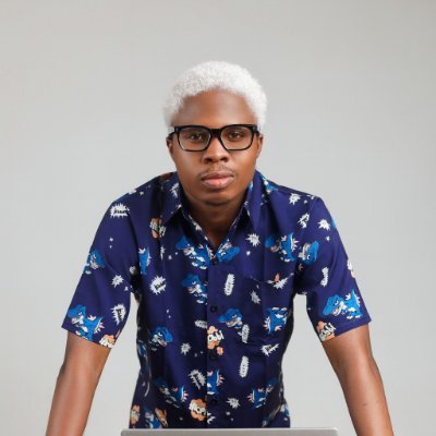 David, LinkedIn ghostwriter, wearing glasses and a blue patterned shirt